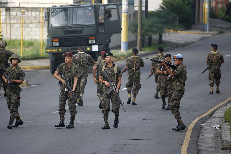 Honduran soldiers block a street near the residence of Honduras' President Manuel Zelaya in Tegucigalpa