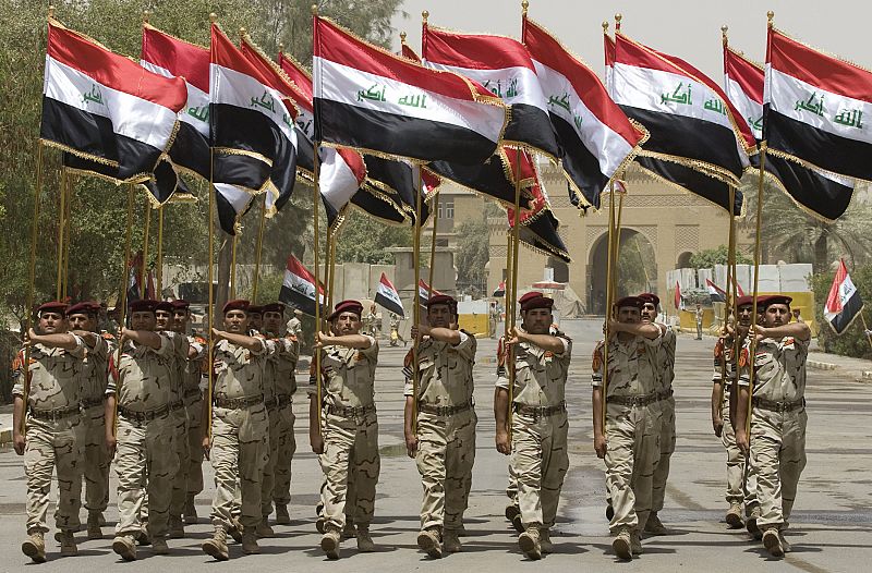 Iraqi soldiers march as they take part in a parade during the transfer ceremony of Baghdad's old defence ministry building