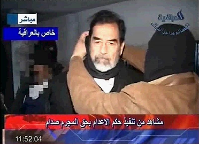 Frame grab from Al Iraqiya television shows cloth being placed around former Iraqi president Saddam's neck moments before his execution in Baghdad