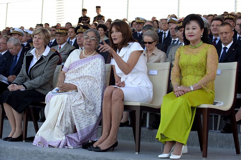 France's President Sarkozy's wife Carla Bruni-Sarkozy attends the Bastille day parade in Paris