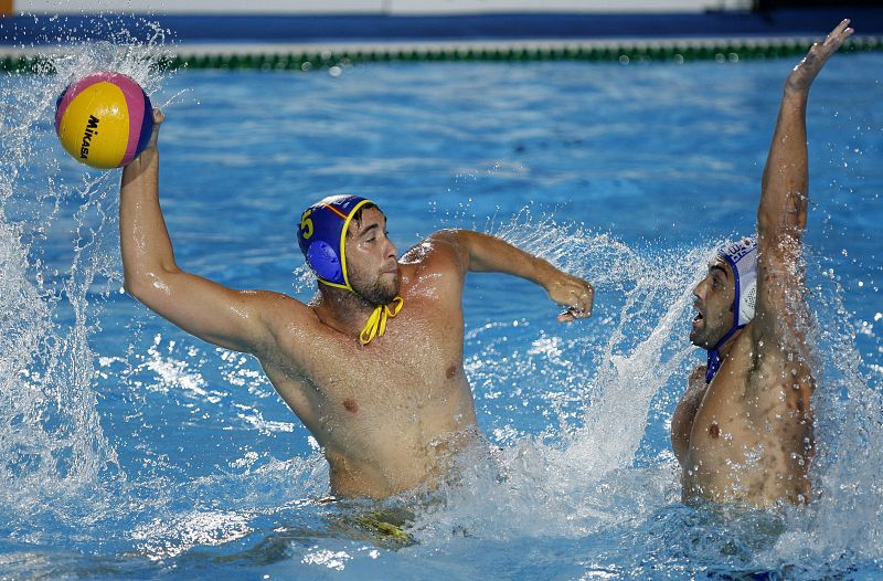 Molina of Spain tries to score on Gocic of Serbia during their men's water polo gold medal match at the World Championships in Rome