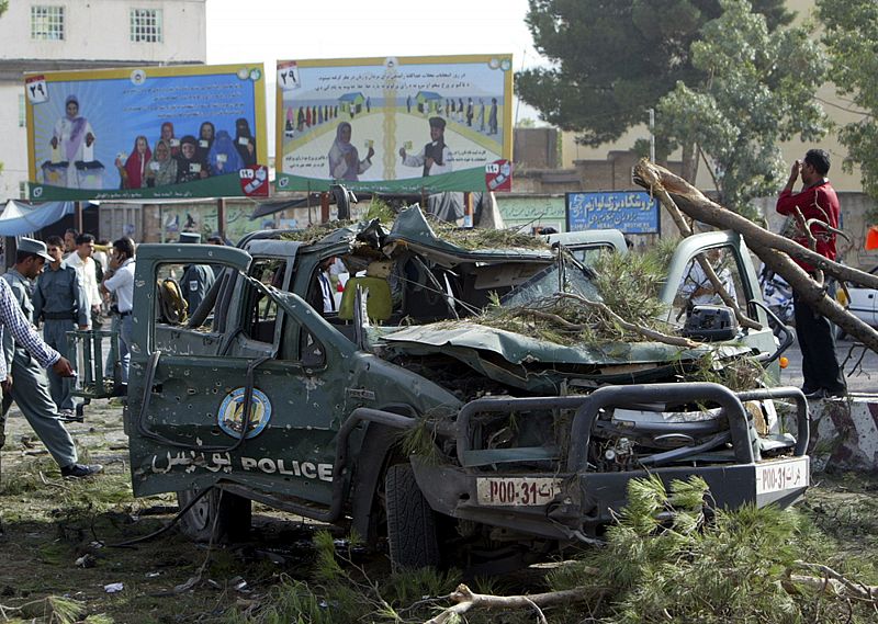 A wreckage of a police car is seen after a roadside bomb blast in the western city of Herat