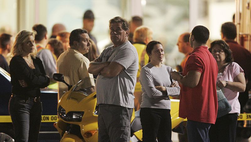 People wait outside the LA Fitness gym in Bridgeville