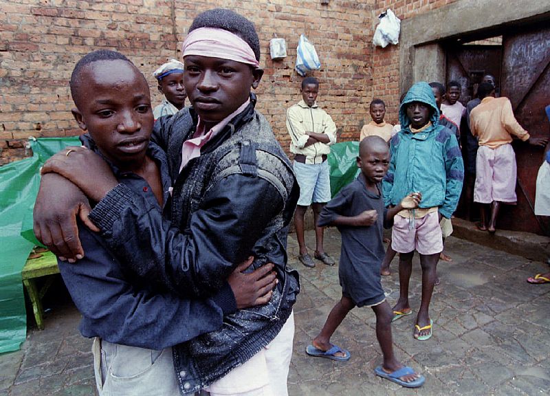 Two adolescents hold onto each other within the childrens ward at the Kigali central prison March 14..