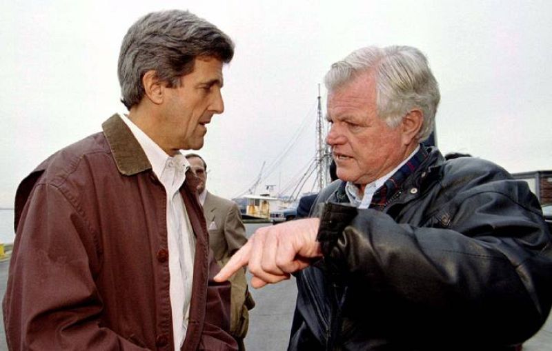 Massachusetts Senators John Kerry (L) and Ted Kennedy confer during a campaign stop for Kerry at Bos..