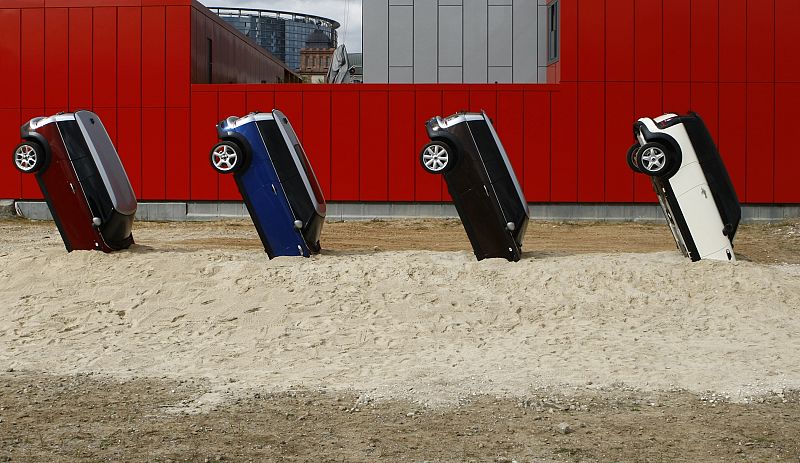 A promotional installation of Mini cars that were stuck into a pile of sand is seen outside the IAA Auto Show in Frankfurt