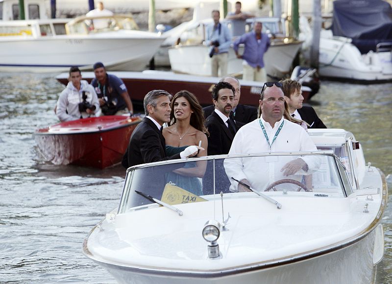 U.S. actor Clooney and his girlfriend Canalis and director Heslov arrive by water taxi during the 66th Venice Film Festival