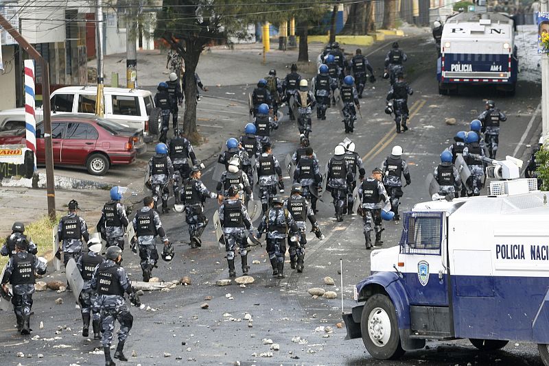 Police walk near the Brazilian embassy after the dispersal of supporters of ousted Honduras President Manuel Zelaya,  in Tegucigalpa