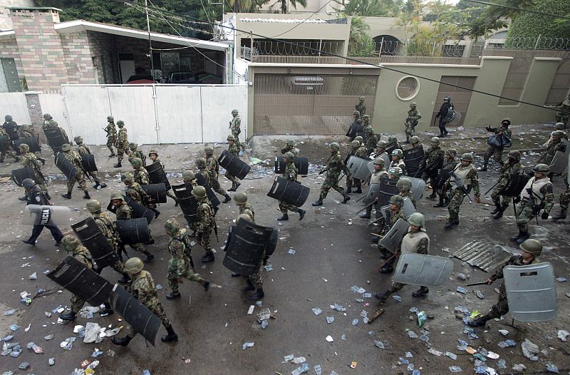 Soldiers walk outside the Brazilian embassy after dispersing supporters of ousted Honduras President Manuel Zelaya,  in Tegucigalpa