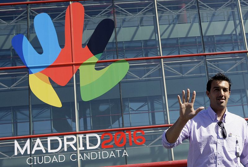 Spain's Olympic bronze medalist in fencing, Jose Luis Abajo, poses in front of the logo for Madrid's 2016 Olympic bid