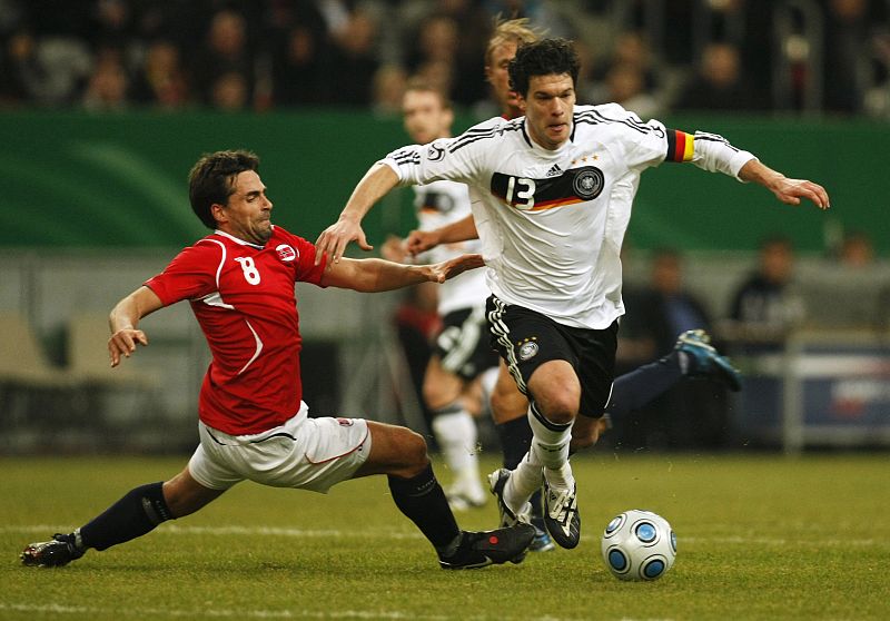 Norway's Braaten challenges Germany's Ballack during friendly match in Duesseldorf