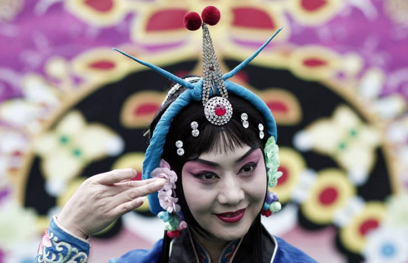A dancer of the Beijing Opera attends a show at the Frankfurt book fair