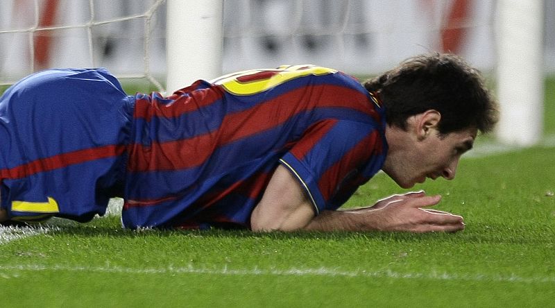 Barcelona's Leo Messi reacts after missing a chance to score during their Champions League soccer match against Rubin Kazan at the Camp Nou stadium