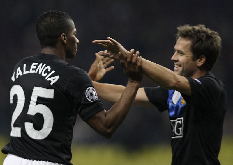 Manchester United's Antonio Valencia and Michael Owen celebrate after scoring a goal during their Champions League soccer match against CSKA Moscow at Luzhniki stadium in Moscow