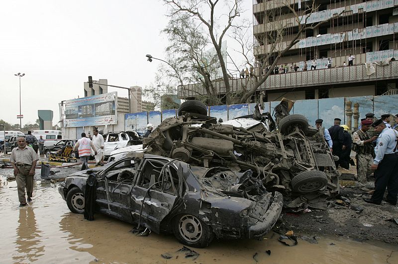 Overturned cars are pictured after two car bombs targeting the Ministry of Justice and the Baghdad Provincial Council exploded in central Baghdad