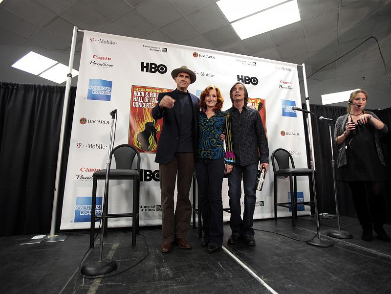 Musicians Taylor, Raitt, and Jackson Browne stand backstage during the first of two 25th Anniversary Rock & Roll Hall of Fame concerts in New York