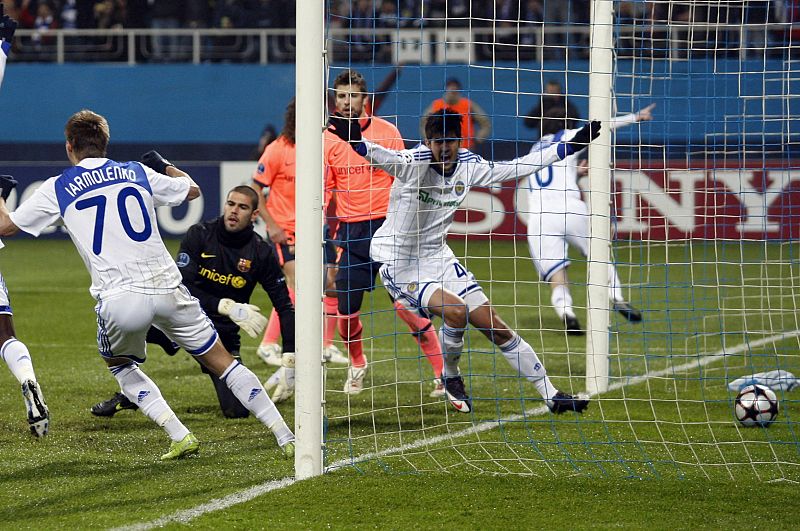 Dynamo Kiev's Almeida and Andriy Yarmolenko celebrate a goal against Barcelona's during their Champions League soccer match at the Valeriy Lobanovskyy stadium in Kiev