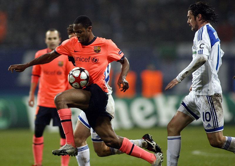 Dynamo Kiev's Milevskiy challenges Barcelona's Keita during their Champions League soccer match at the Valeriy Lobanovskyy stadium in Kiev