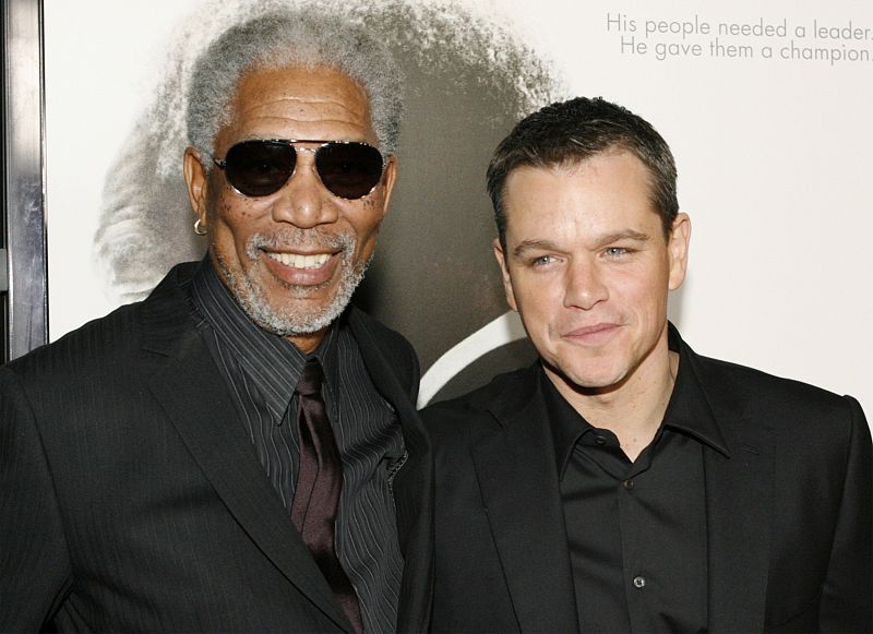 Actor Morgan Freeman poses with actor Matt Damon at the Los Angeles premiere of director Clint Eastwood's film "Invictus" in Beverly Hills