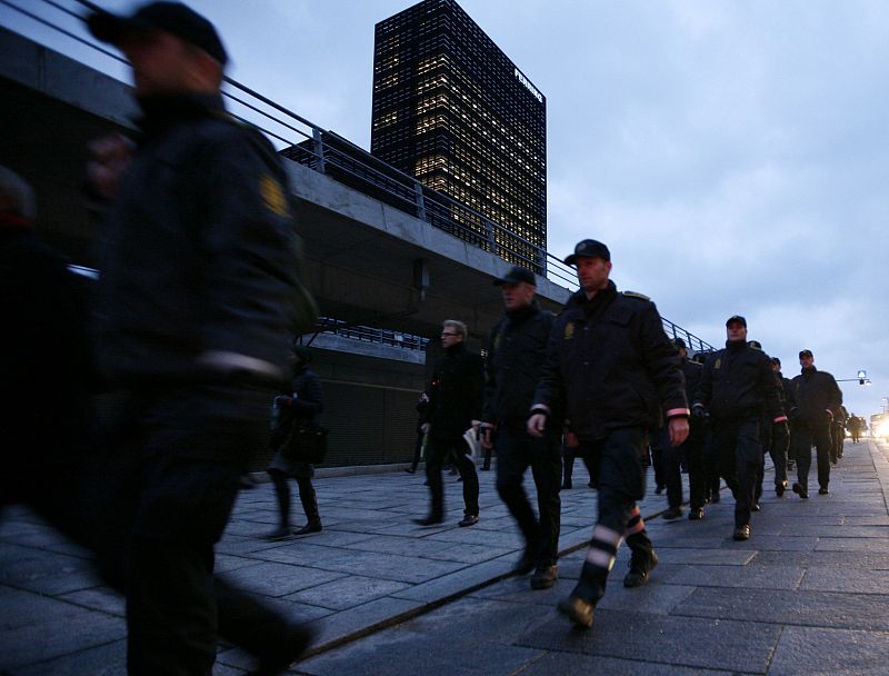 Danish police officers march to secure the UN Climate Change 2009 Conference at the Bella Center in Copenhagen