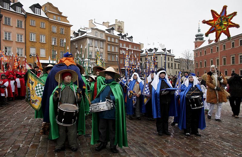 Participants take part in the Three Kings procession at Old Town in Warsaw