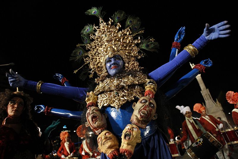 An actress performs during the annual Epiphany parade as it makes its way through central Madrid