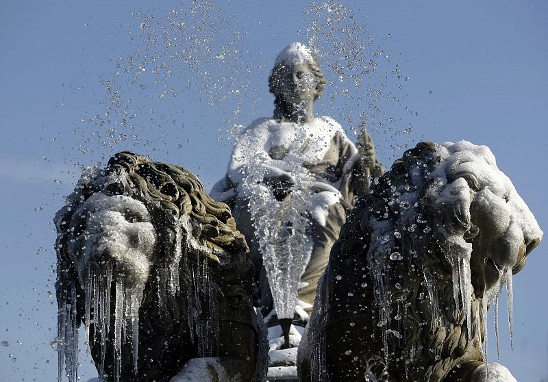 Ice and snow cover Madrid's famous landmark Cibeles fountain in downtown Madrid