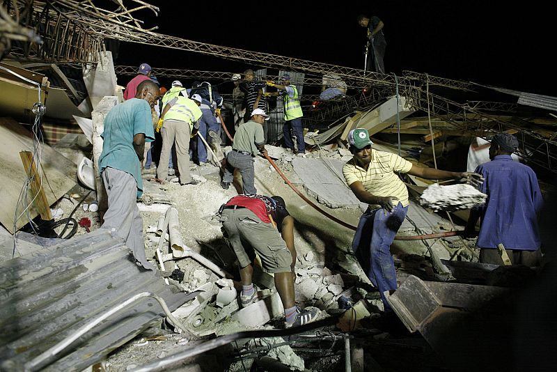 Residents search for victims after an earthquake in Port-au-Prince
