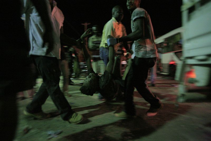Resident wait for medical treatment after an earthquake in Port-au-Prince