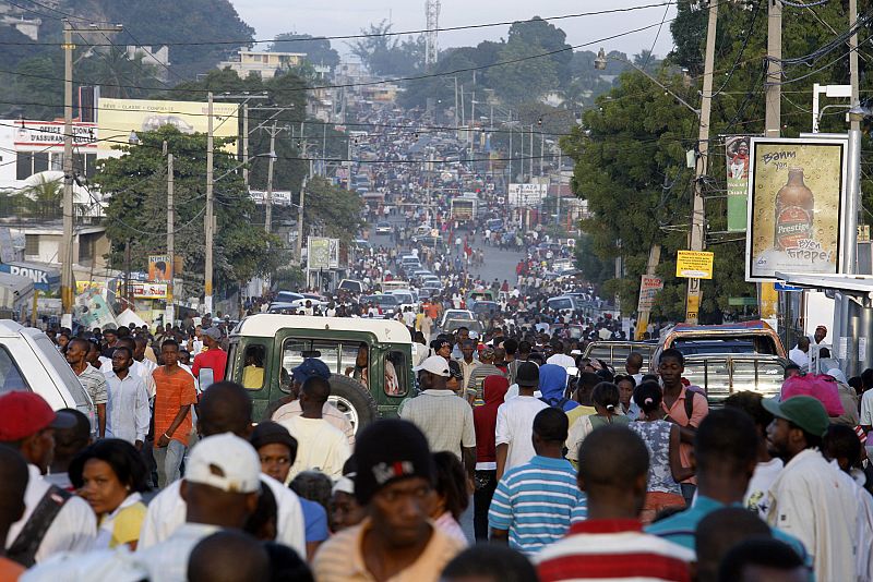 People walk in Delmas street after an earthquake in Port-au-Prince