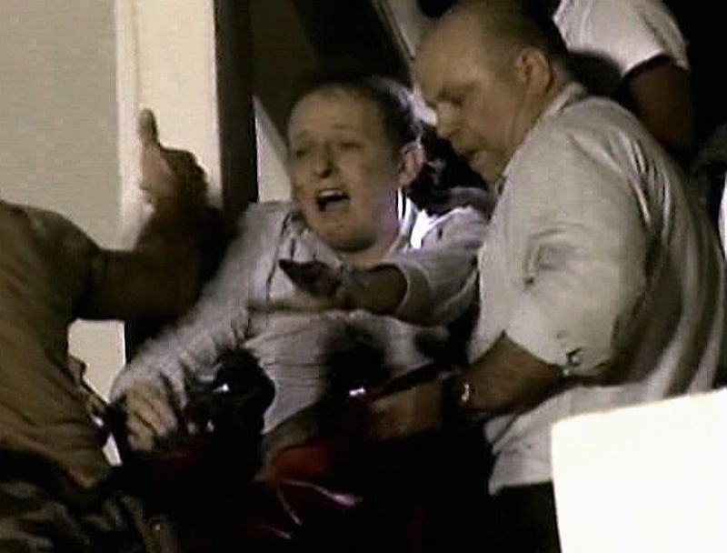 Peacekeepers carry a survivor from the rubble of the headquarters of the United Nations (UN) Stabilization Mission in Haiti after a major earthquake struck in Port-au-Prince