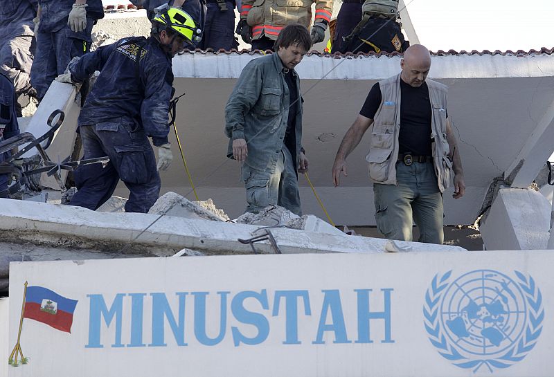 U.N. member Tarmo Joveer, 35, from Estonia is rescued after an earthquake in Port-au-Prince