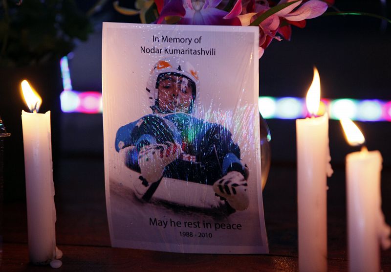 A postcard flanked by candles reads 'in memory of Nodar Kumaritashvili - may he rest in peace 1988-2010' at the Whistler medal plaza ahead of the Vancouver 2010 Winter Olympics in Whistler