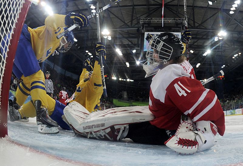 Sweden's Johansson celebrates third period goal against Switzerland in their preliminary women's hockey game at the Vancouver 2010 Winter Olympics