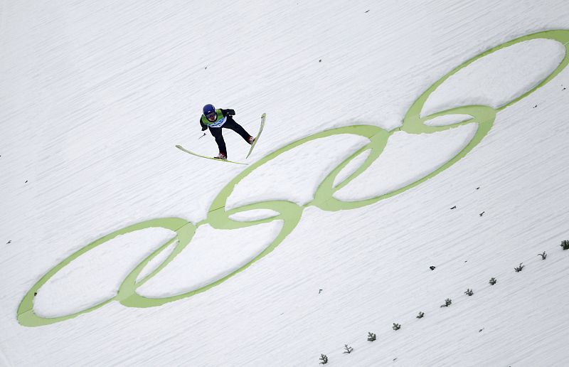 Poland's Malysz  through the air during first round of the individual normal hill ski jumping at the Vancouver 2010 Winter Olympics in Whistler.