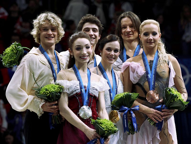 Medallists stand together after the ice dance figure skating event at the Vancouver Winter Olympics