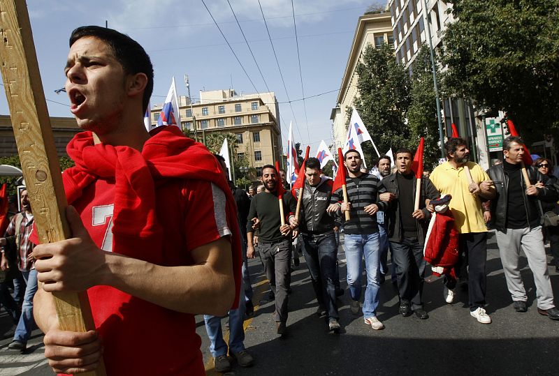 Protesters shout slogans as they march to the parliament during an anti-government rally in Athens