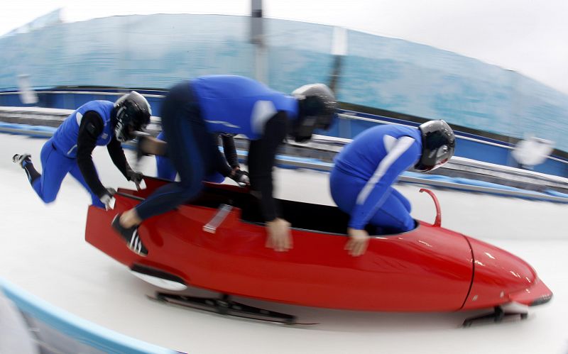 Italy's four-man bobsleigh team piloted by Simone Bertazzo starts a training heat at the Vancouver 2010 Winter Olympics in Whistler