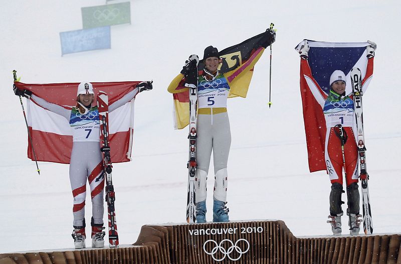 Austria's Schild, Germany's gold medalist Riesch and Czech Republic's Zahrobska pose during the flower ceremony of the women's alpine skiing slalom event at the Vancouver 2010 Winter Olympics in Whistler