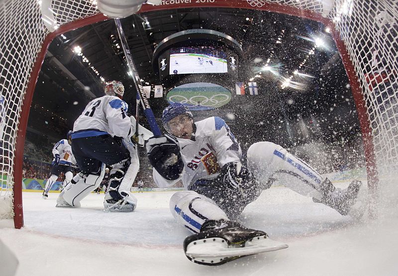 Filppula of Finland slides into the net during game against the U.S. in the play-offs semifinals at the Vancouver 2010 Winter Olympics