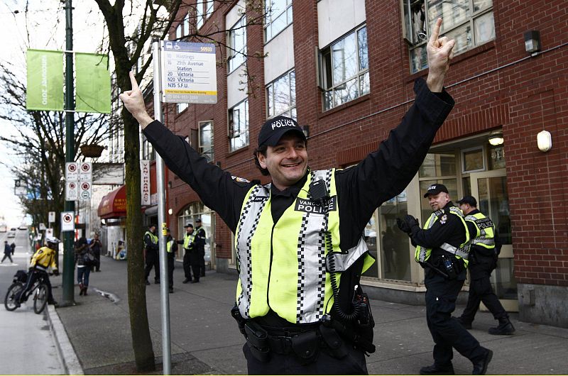 Vancouver police department officer Roberts celebrates Canada's victory over the U.S. in the men's ice hockey gold medal game at the Vancouver 2010 Winter Olympics