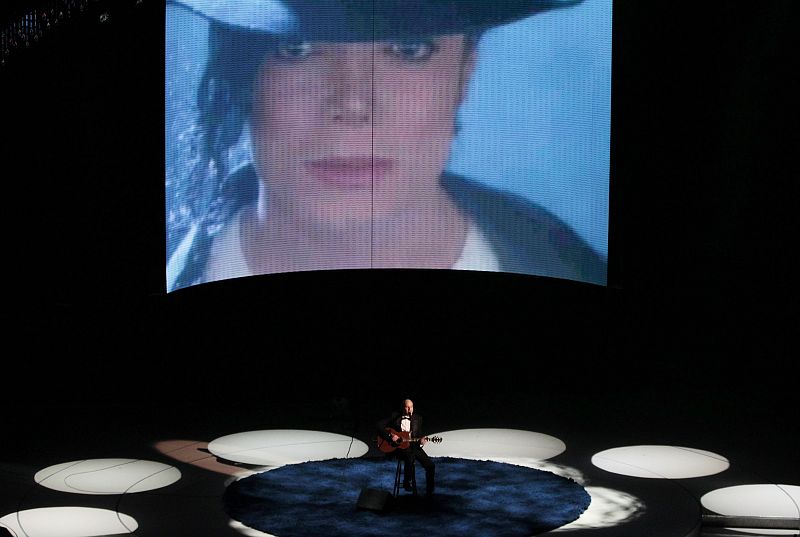 Singer Taylor performs as a picture of Jackson is displayed during a segment at 82nd Academy Awards in Hollywood