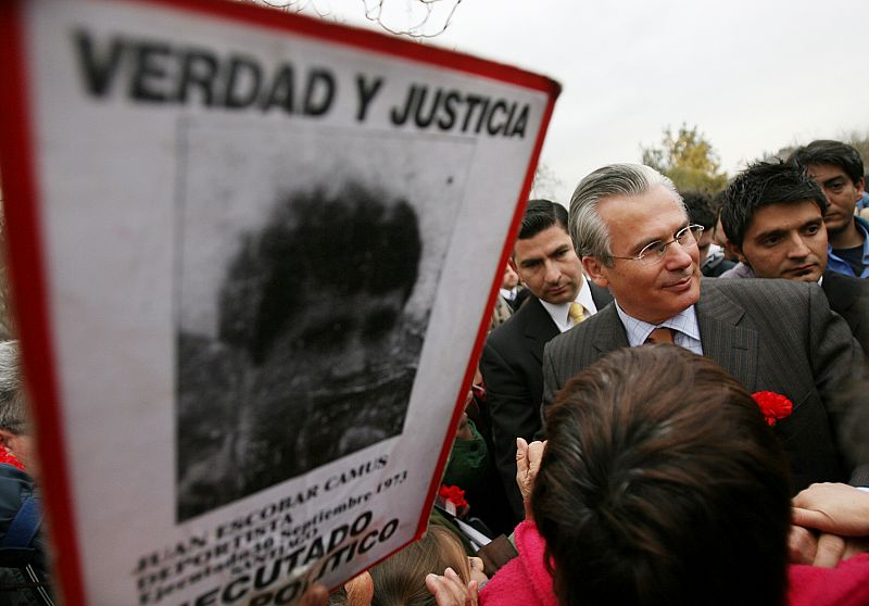 Spanish judge Baltasar Garzon is greeted during his visit to"Patio 29" in Santiago