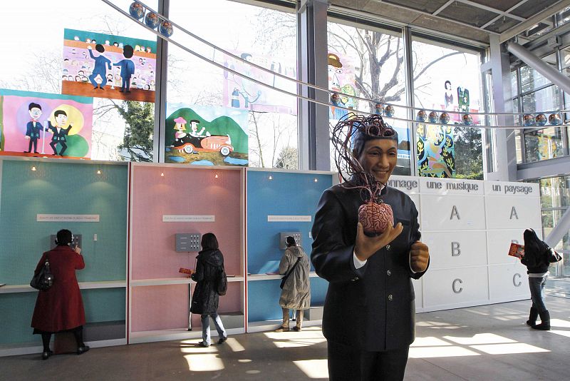 Guests look at works by Japanese artist Kitano, at the Cartier Foundation for Contemporary Art which is part of his show in Paris