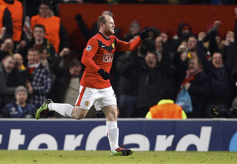 Manchester United's Rooney celebrates after scoring during their Champions League match against AC Milan at Old Trafford in Manchester