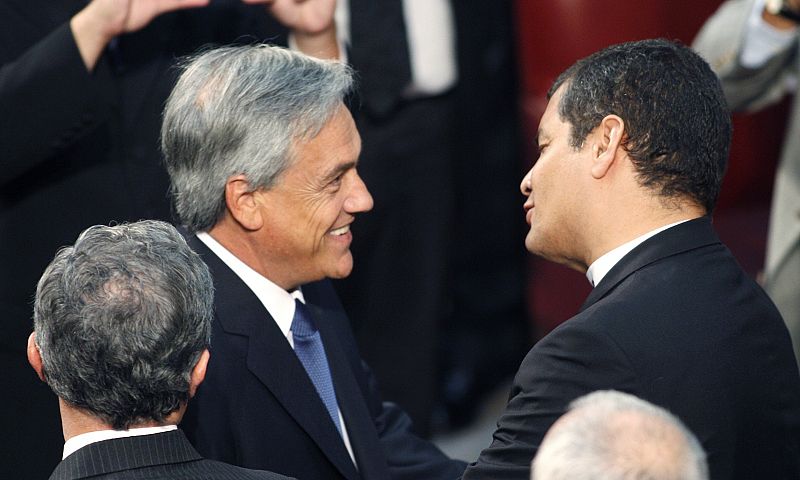 Chile's President Pinera greets Ecuador's President Correa after Pinera was sworn in at the Congress in Valparaiso