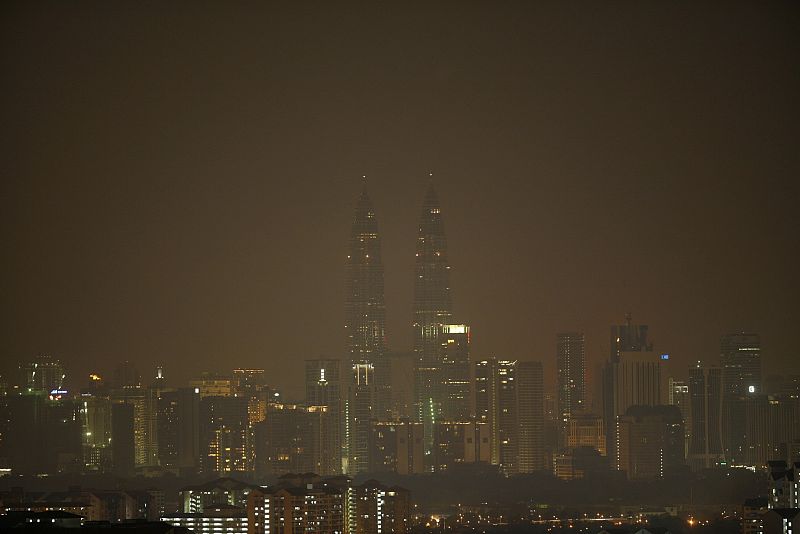 The lights of Malaysia's landmarks Petronas Twin Towers are turned off during the Earth Hour in Kuala Lumpur