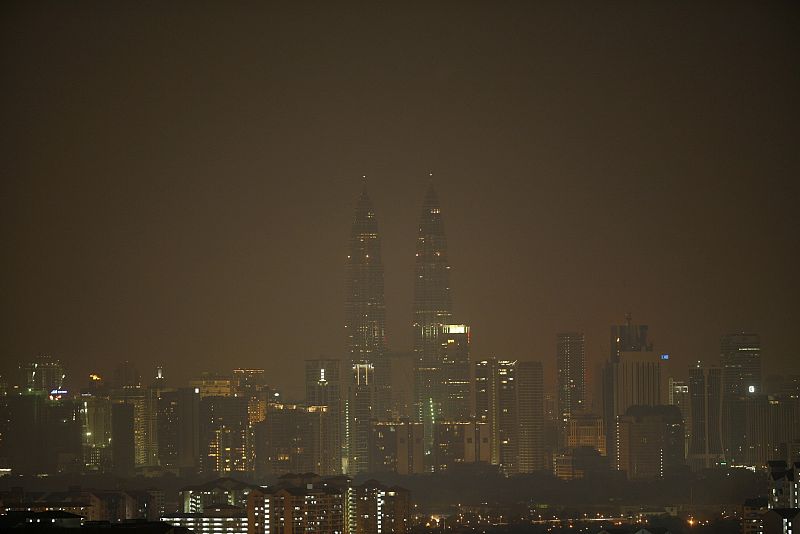 The lights of Malaysia's landmarks Petronas Twin Towers are turned off during the Earth Hour in Kuala Lumpur