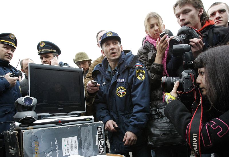 Emergencies Ministry members and journalists are seen during a video conference in Moscow