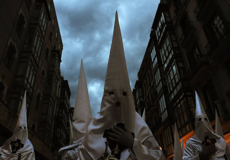 Penitents prepare for a Holy Week procession in Bilbao